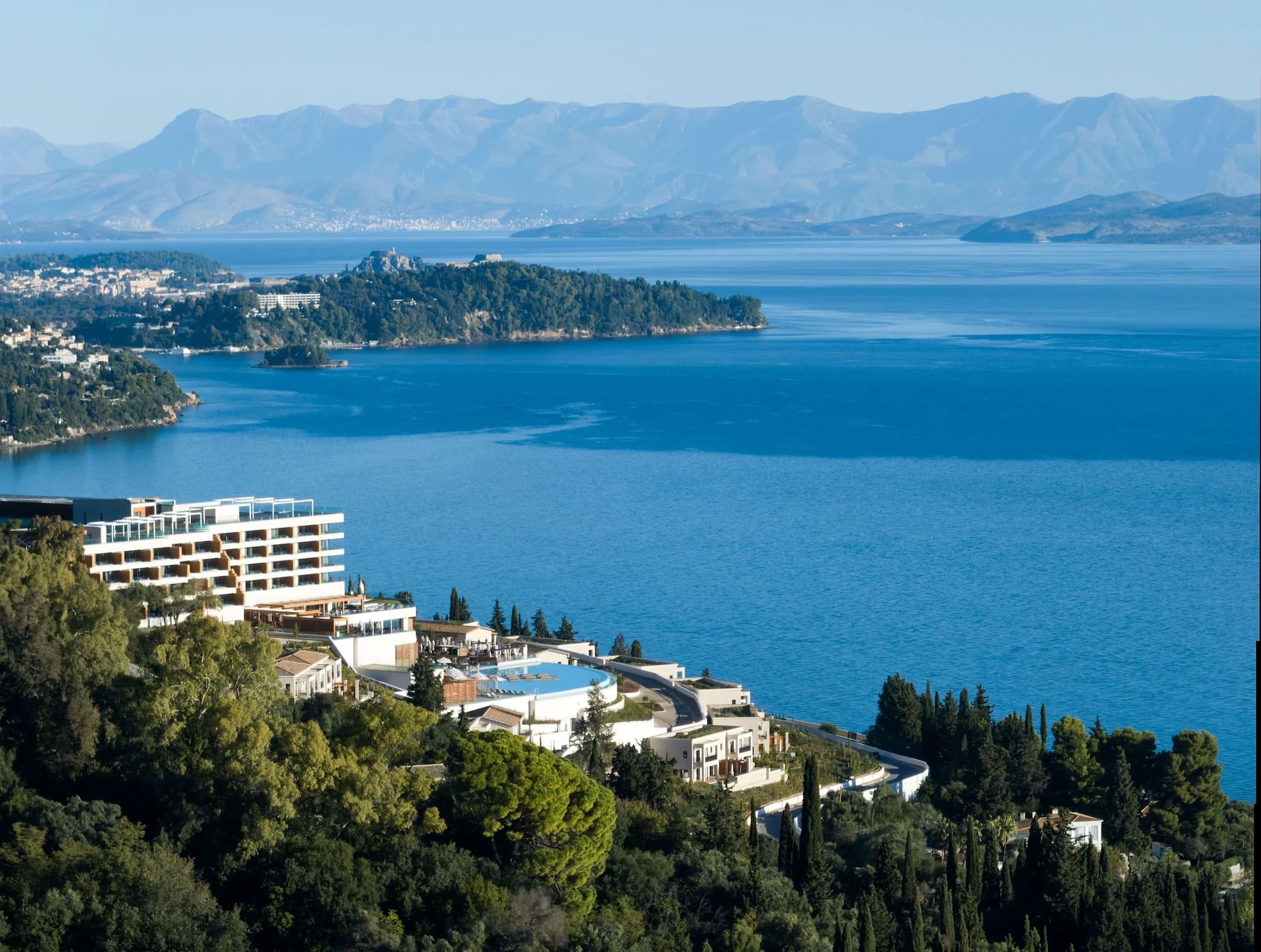 angsana corfu resort nestled in the forest with ionian sea behind